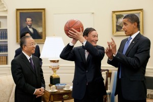 Chinese Vice Premier Wang Qishan, center, holds the basketball given to him by President Barack Obama following their Oval Office meeting Tuesday, July 28, 2009, to discuss the outcomes of the first U.S.-China Strategic and Economic Dialogue.  Looking on at left is Chinese State Councilor Dai Bingguo. (Official White House Photo by Pete Souza)